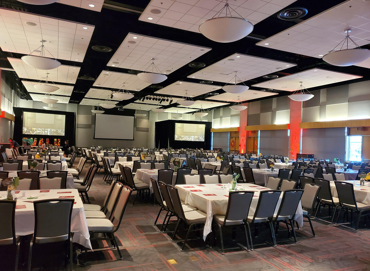 UNLV Student Union ballroom arranged with banquet tables and projection screens
