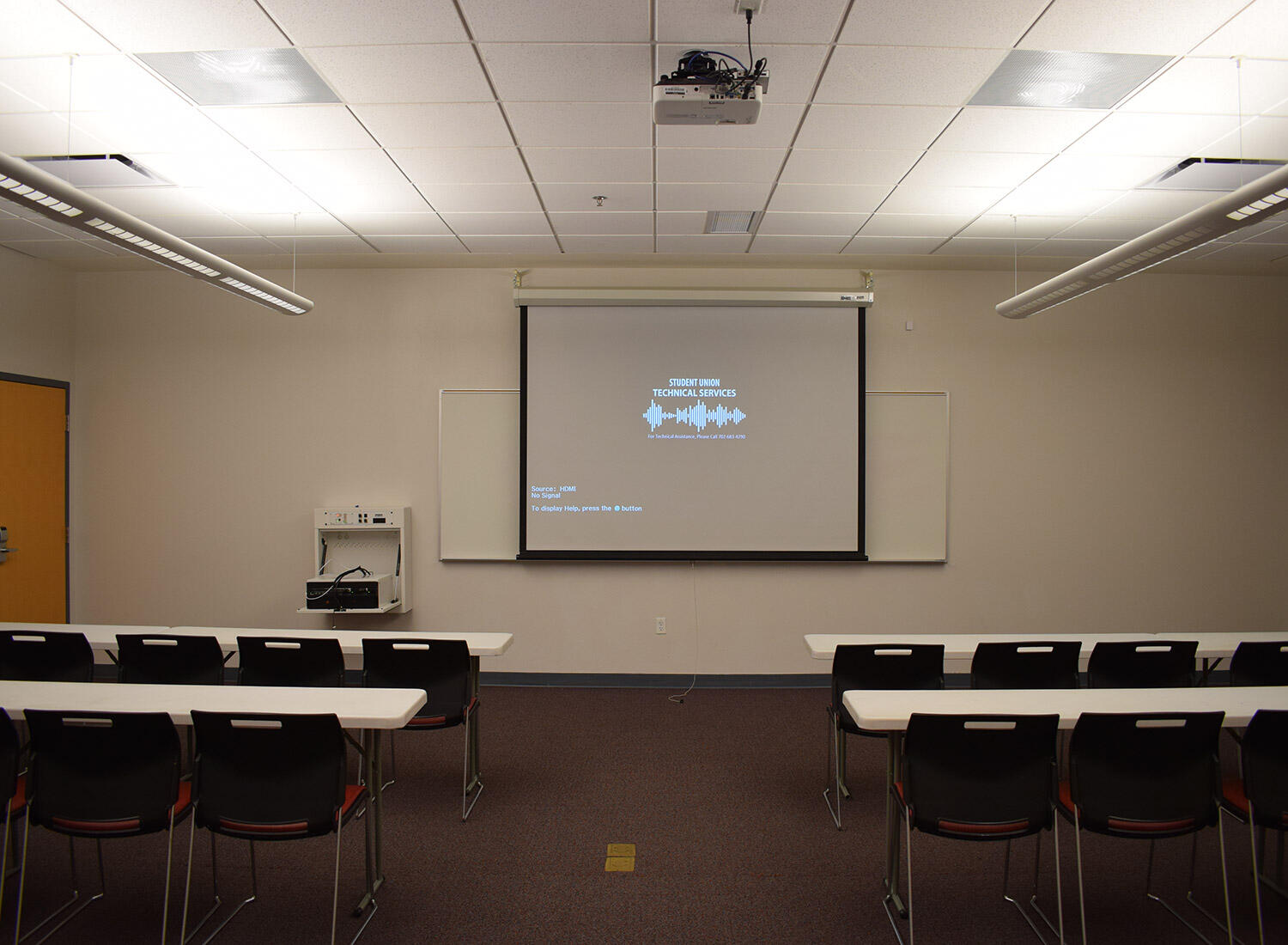 UNLV Student Union meeting room with classroom seating and a projection screen