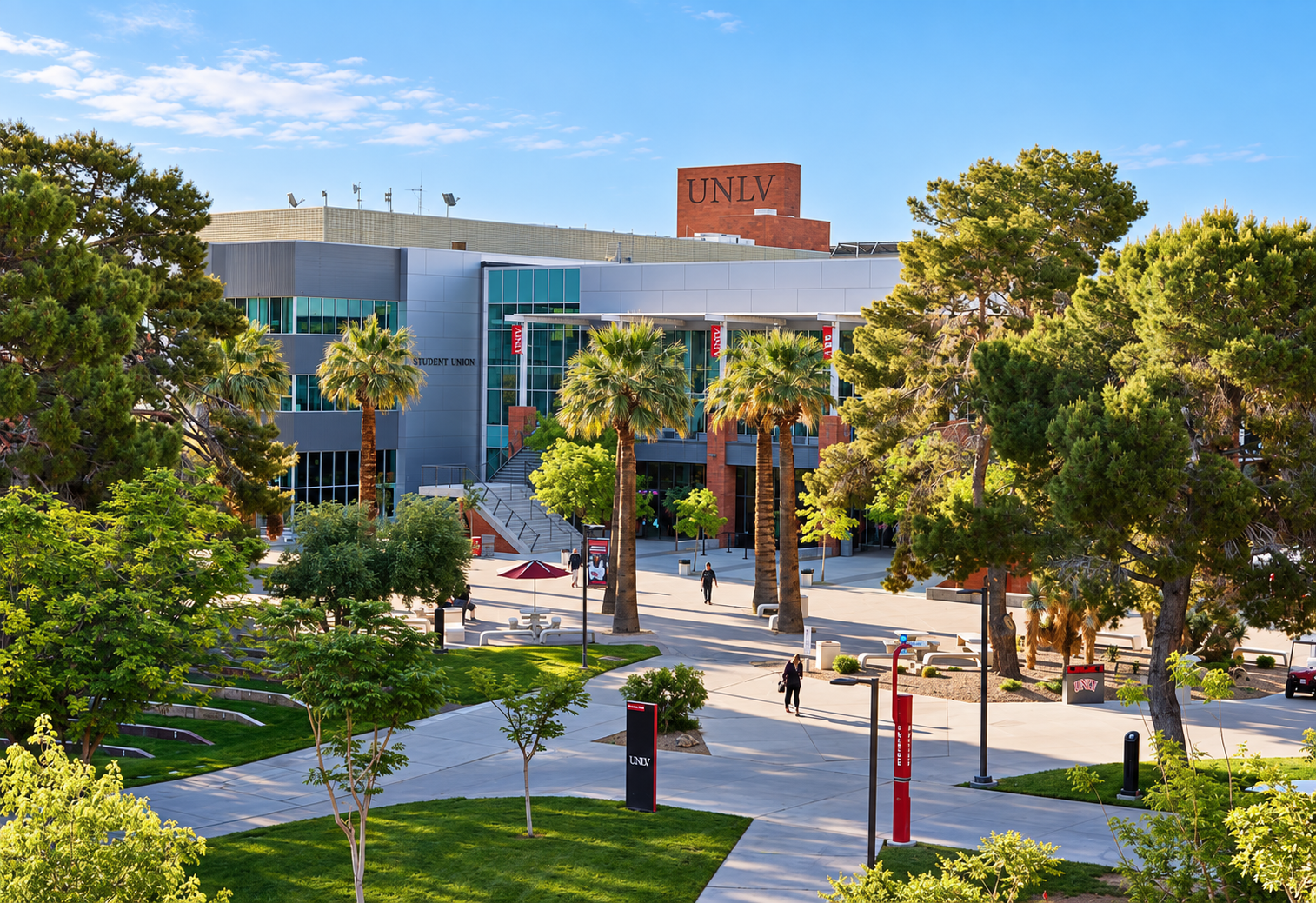 UNLV Student Union framed by palm trees and landscaped campus walkways